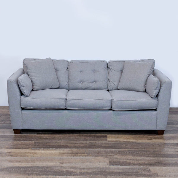 1. Front view of a La-Z-Boy 3-seat sofa with thin arms, buttoned back, and decorative wood legs.  