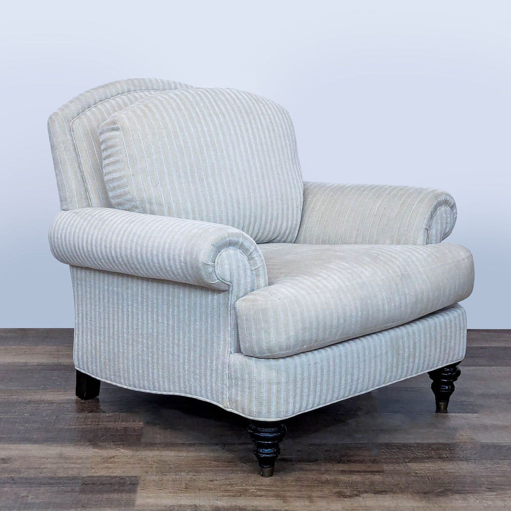 2. Reperch striped lounge chair featuring rolled arms and turned legs with brass caps, angled side view.