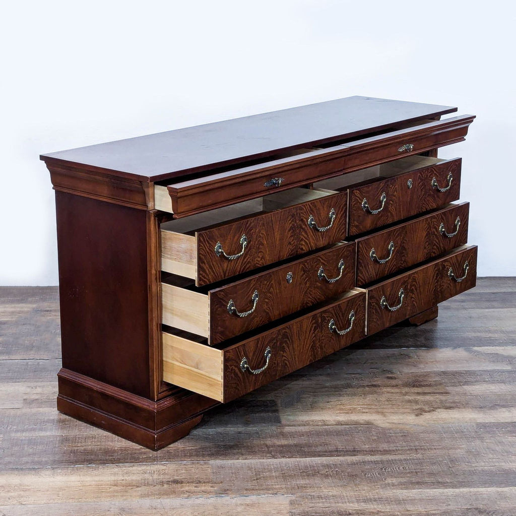 2. Side view of Drexel Studio dresser showing open drawers and detailed brass handles.  