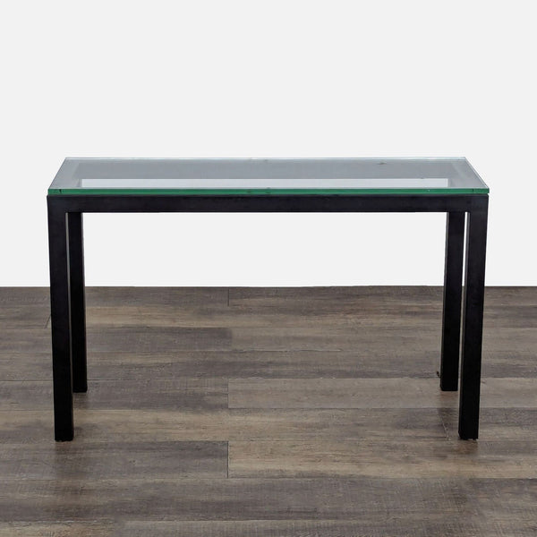 1. Crate and Barrel side console table with a clear glass top and powder-coated steel frame, modern design.