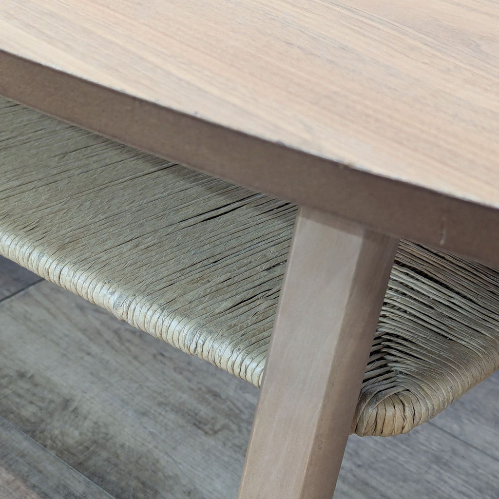 2. Close-up of the raffia-wrapped lower shelf on a Reperch mid-century style coffee table.  