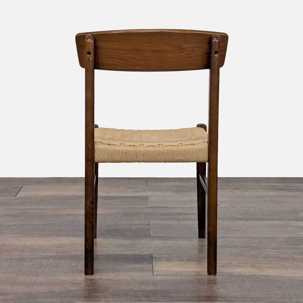 2. Rear view of a Reperch dining chair, showing the curved wooden backrest and woven seat detail.