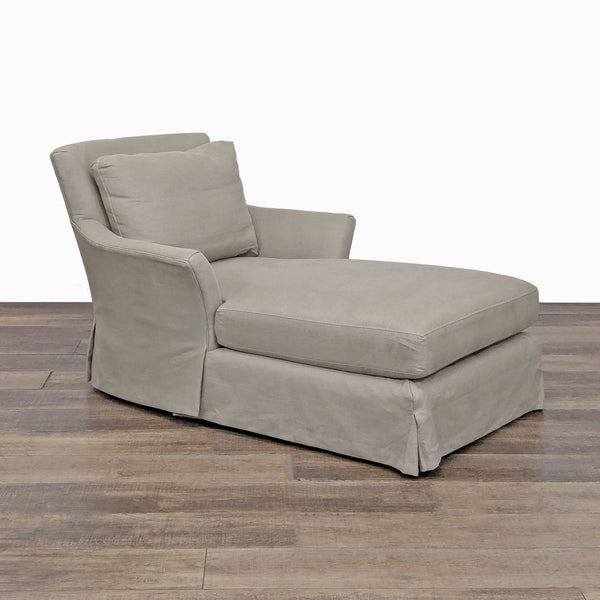 1. Crate and Barrel lounge chaise with European rolled arms, plush cushions, and removable slipcover, angled view.