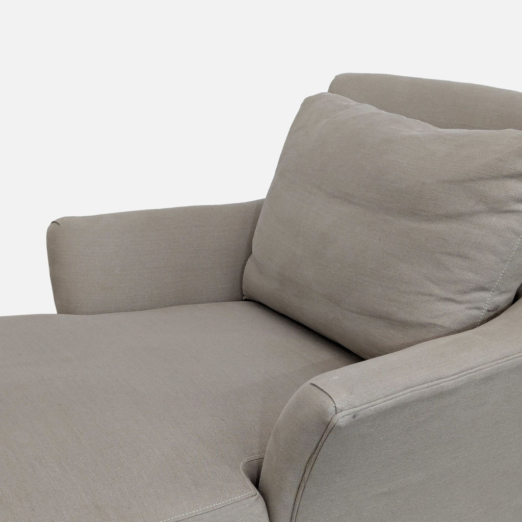 3. Close-up of Crate and Barrel lounge chair’s rolled arm, cushion, and removable slipcover fabric detail.