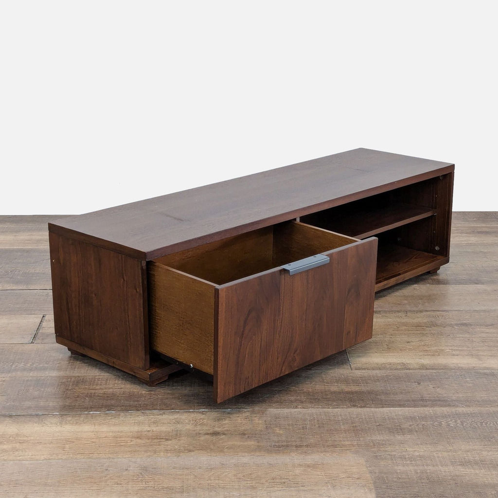 2. Angled view of a West Elm Entertainment Center showing the storage drawer open and shelves on the side.  