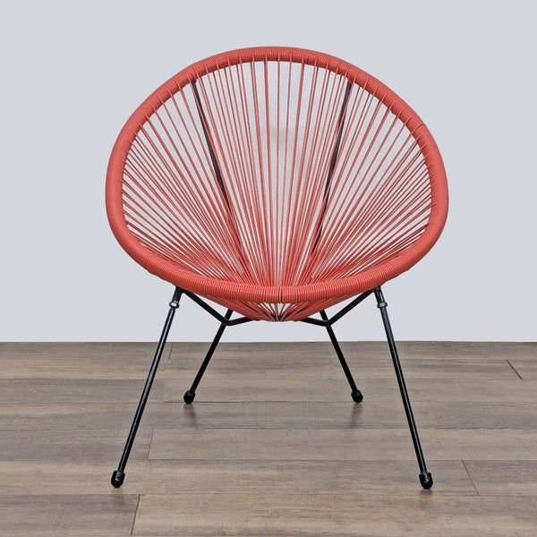 1. Front view of a Reperch basket style chair with a weather-resistant woven seat and steel frame.