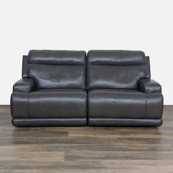 1. Living Spaces loveseat with power recline, adjustable headrests, and lumbar support, shown in dark leather.  