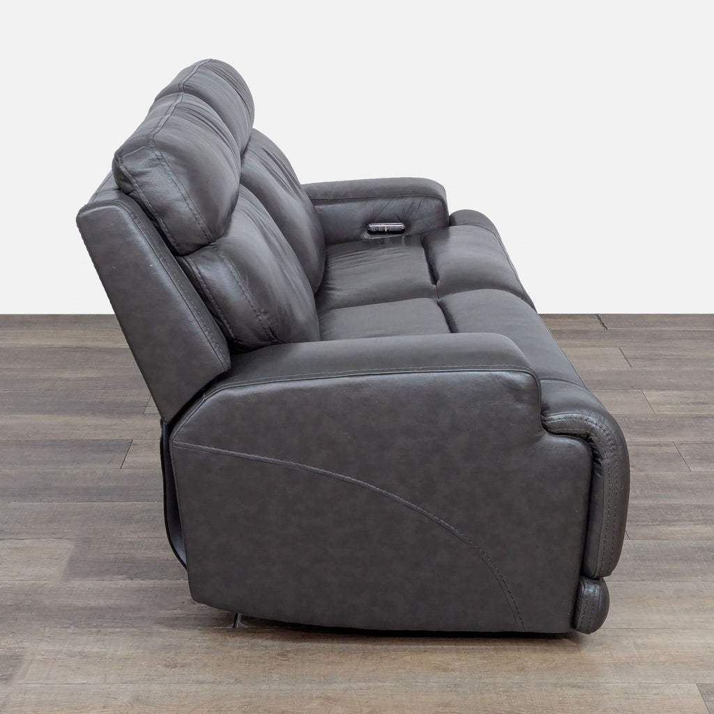 3. Side profile of Living Spaces power recline loveseat emphasizing adjustable headrest and lumbar controls.