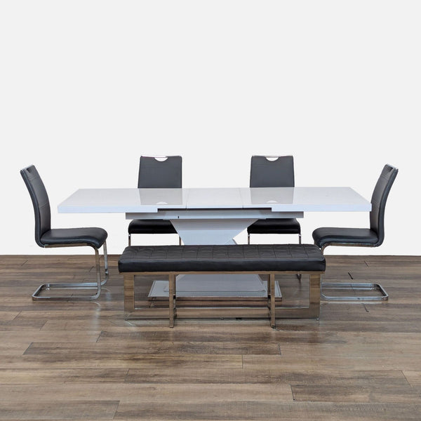 Modern Reperch dining set with expandable table, four black upholstered chairs, and matching metal bench.  