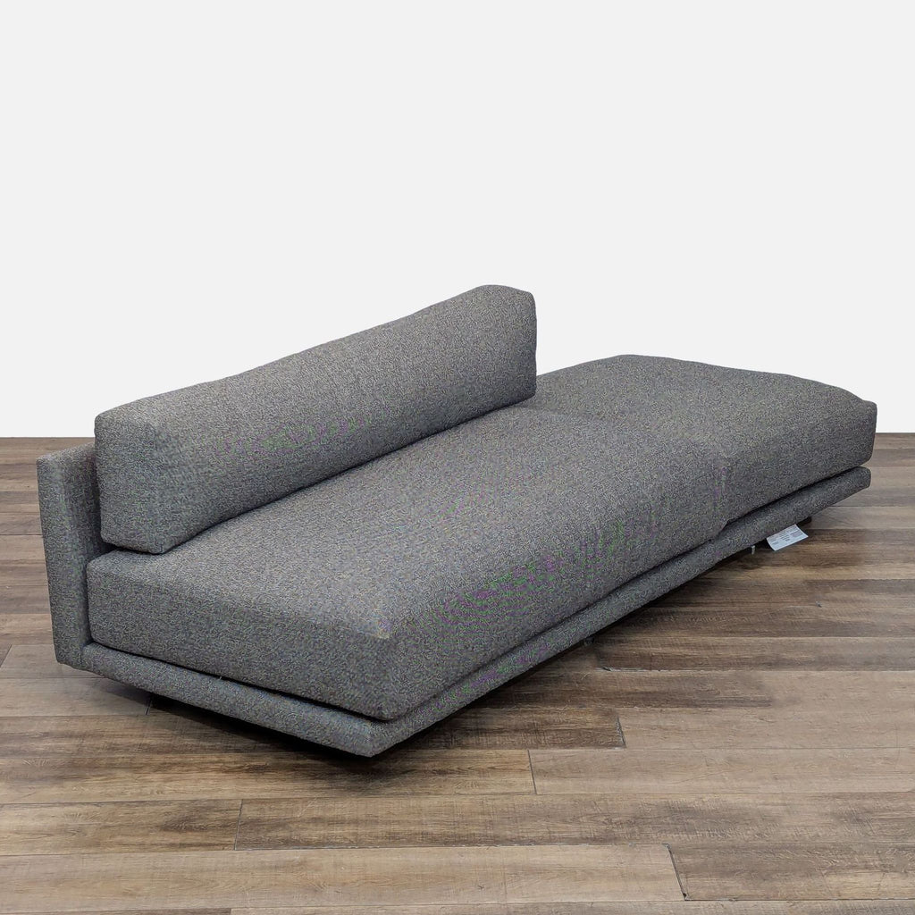 2. Angled view of Blu Dot gray modern sofa, highlighting low profile and plush, thick cushions.