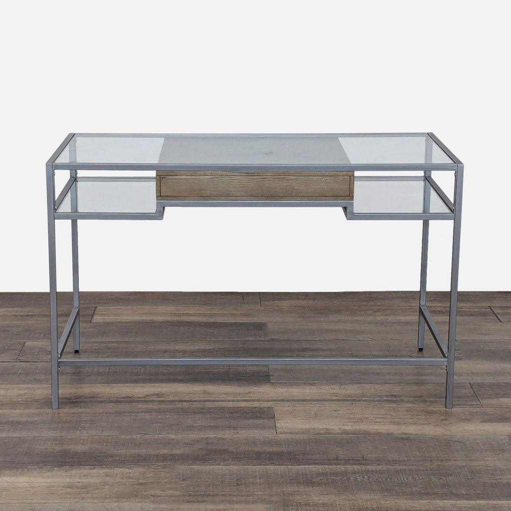 3. Modern desk by Madison Park featuring a metal frame, glass surfaces, and a central wood drawer.