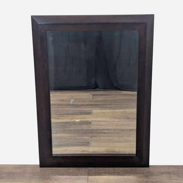 1. Rectangular Crate and Barrel mirror with a wide dark wood frame, shown standing on a wooden floor.