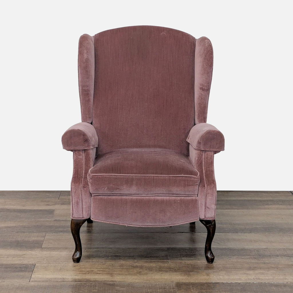 1. Reperch lounge chair with wingback design, rolled arms, and wooden legs, front view.