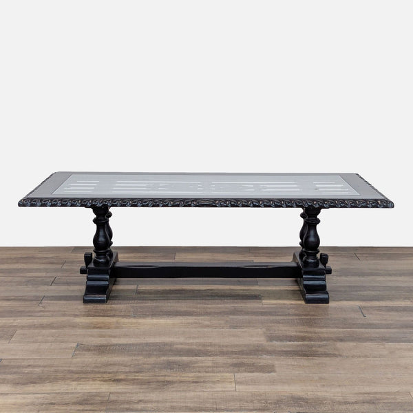 1. Hand-carved Reperch dining table featuring a wrought iron panel beneath a glass top, trestle base design.  