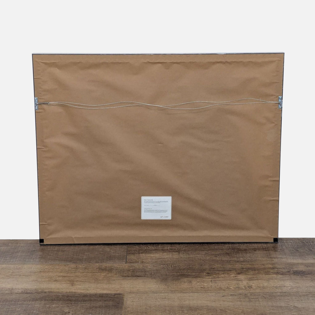 2. Back view of the Pierre Farel framed print with mounting wire and Art.com label visible.  