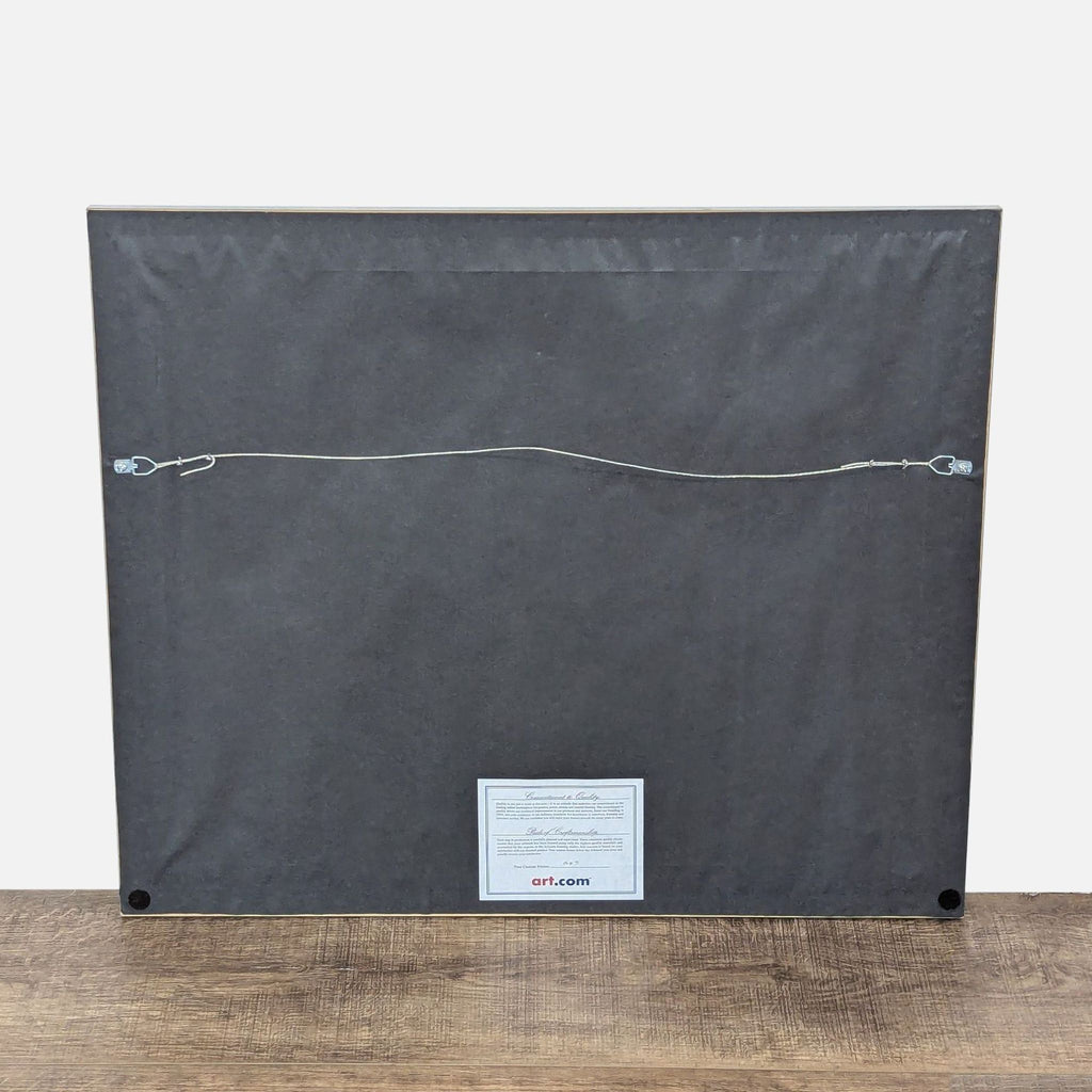 3. Rear view of Pierre Farel artwork frame with Art.com label and attached hanging wire for wall display.