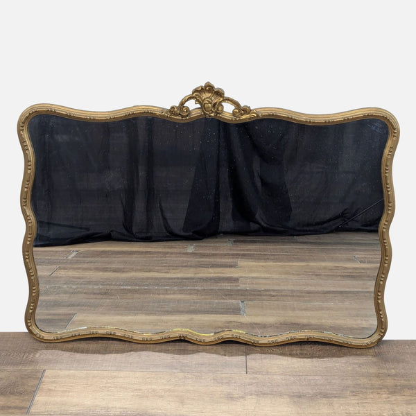 1. Ornate Reperch mirror with gold frame, scalloped edges, and decorative top detail, placed on wooden floor.