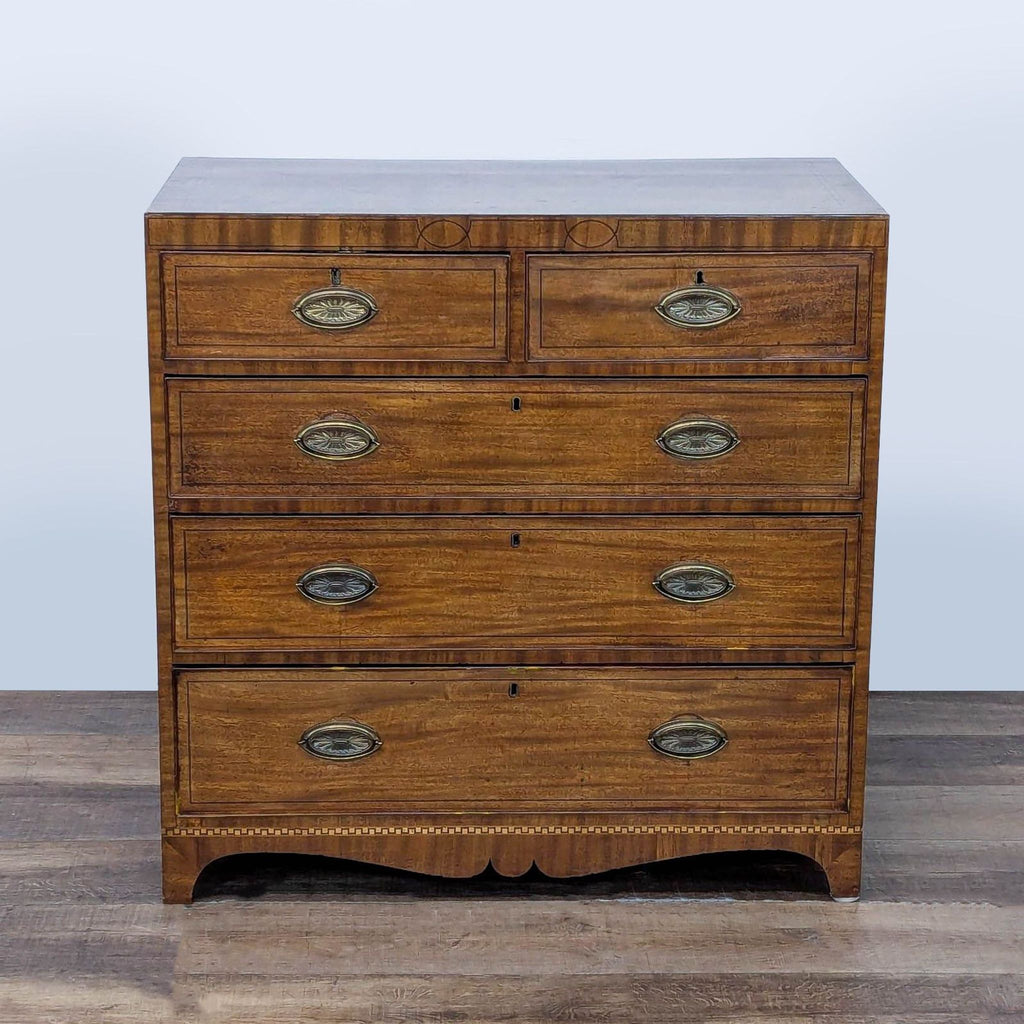 1. Vintage wood dresser by Reperch with brass drop handles and inlay detail, five drawers, front view.  