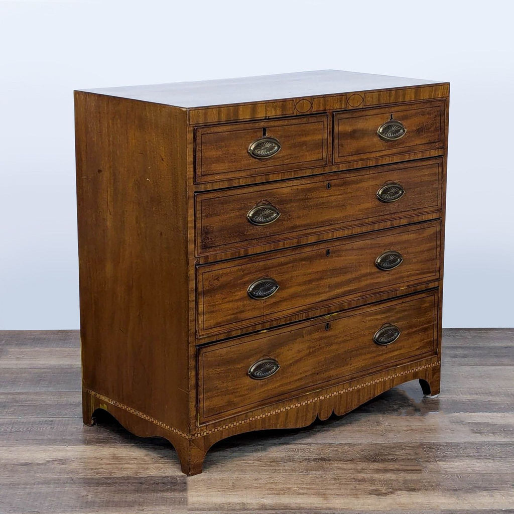 3. Angled view of Reperch vintage wood dresser, featuring wood veneer, inlay detailing, and brass handles.