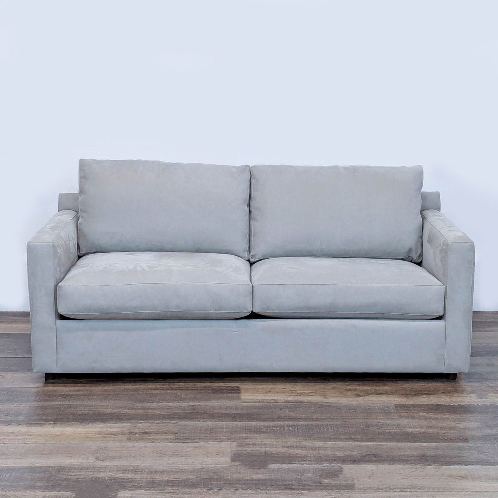 1. Front view of a Restoration Hardware track arm loveseat sleeper sofa in light gray fabric on a wooden floor.