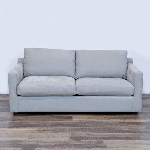 1. Front view of a Restoration Hardware track arm loveseat sleeper sofa in light gray fabric on a wooden floor.