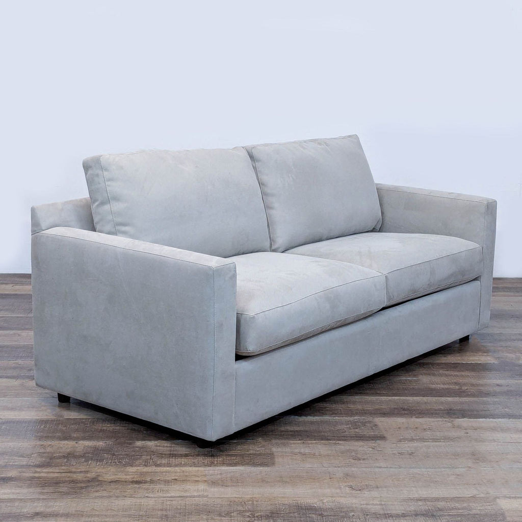3. Angled view of a Restoration Hardware track arm loveseat sleeper sofa, featuring plush cushions and modern style.