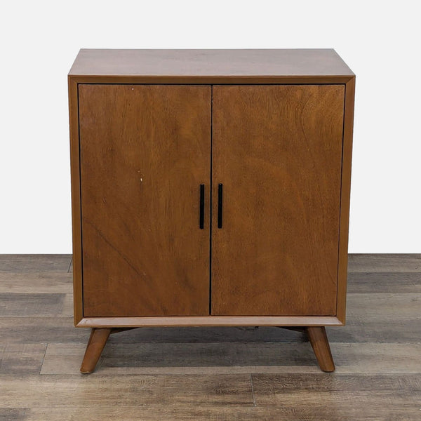 1. Eucalyptus wood cabinet by West Elm with double doors and bronze-finished metal hardware, closed view.