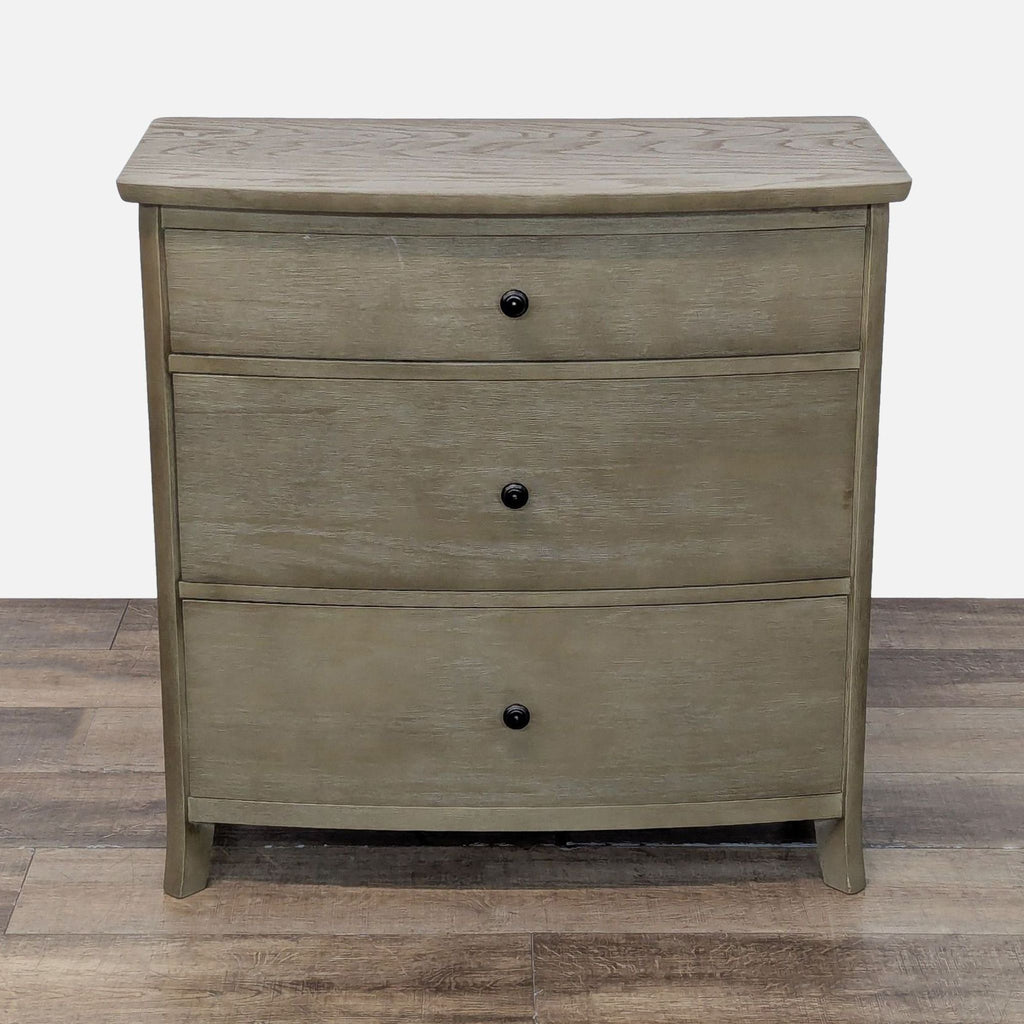 Williams-Sonoma dresser with three drawers, metal glides, and metal pulls, finished in a neutral wood tone.  