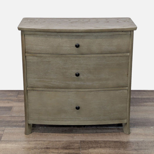 Williams-Sonoma dresser with three drawers, metal glides, and metal pulls, finished in a neutral wood tone.  