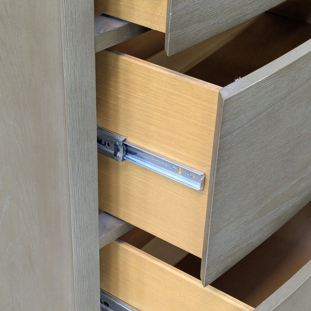 Close-up of the Williams-Sonoma dresser drawer, highlighting metal glide and wood construction details.