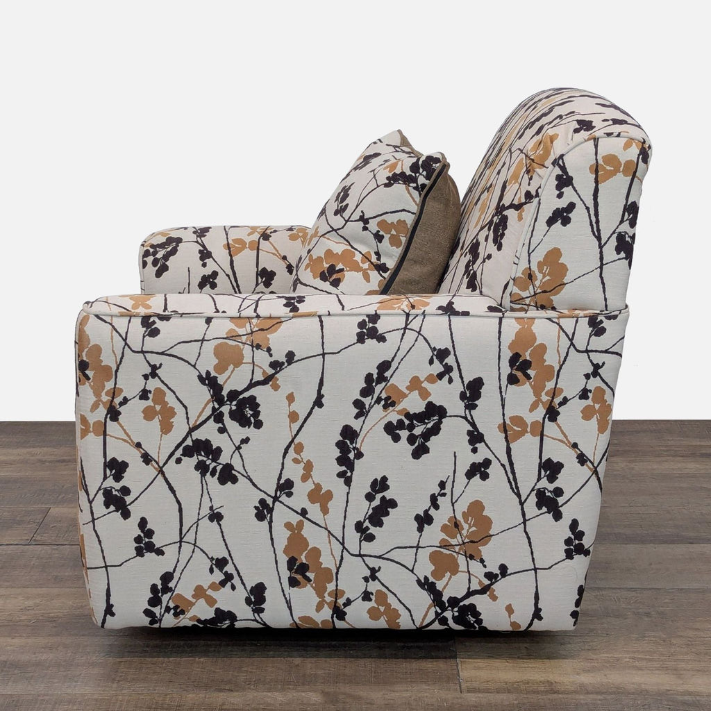3. Ashley Furniture lounge chair, Lounge category, 360-degree swivel, floral pattern, side view with matching cushion.