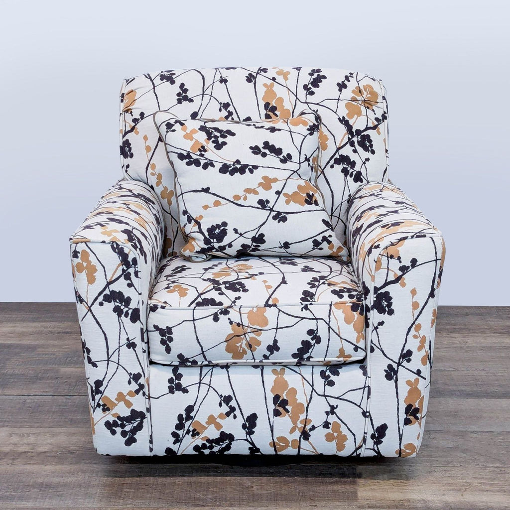 1. Ashley Furniture lounge chair with floral upholstery and cushion, featuring 360-degree swivel base, front view.