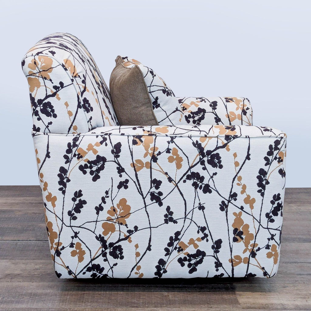 3. Ashley Furniture lounge chair, side profile showing floral upholstery and 360-degree swivel capability.