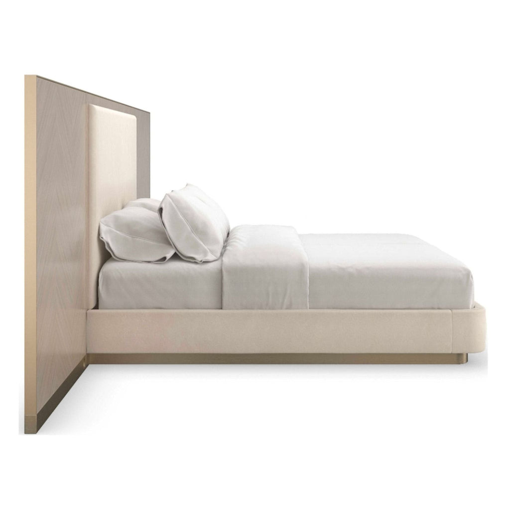 2. Modern Caracole frame bed features wool-like flannel headboard, Chevron veneer wings, and brushed gold plinth base.