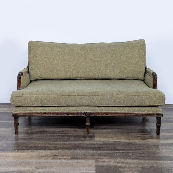 1. Century loveseat with detailed wooden frame and muted green fabric upholstery, viewed from the front.