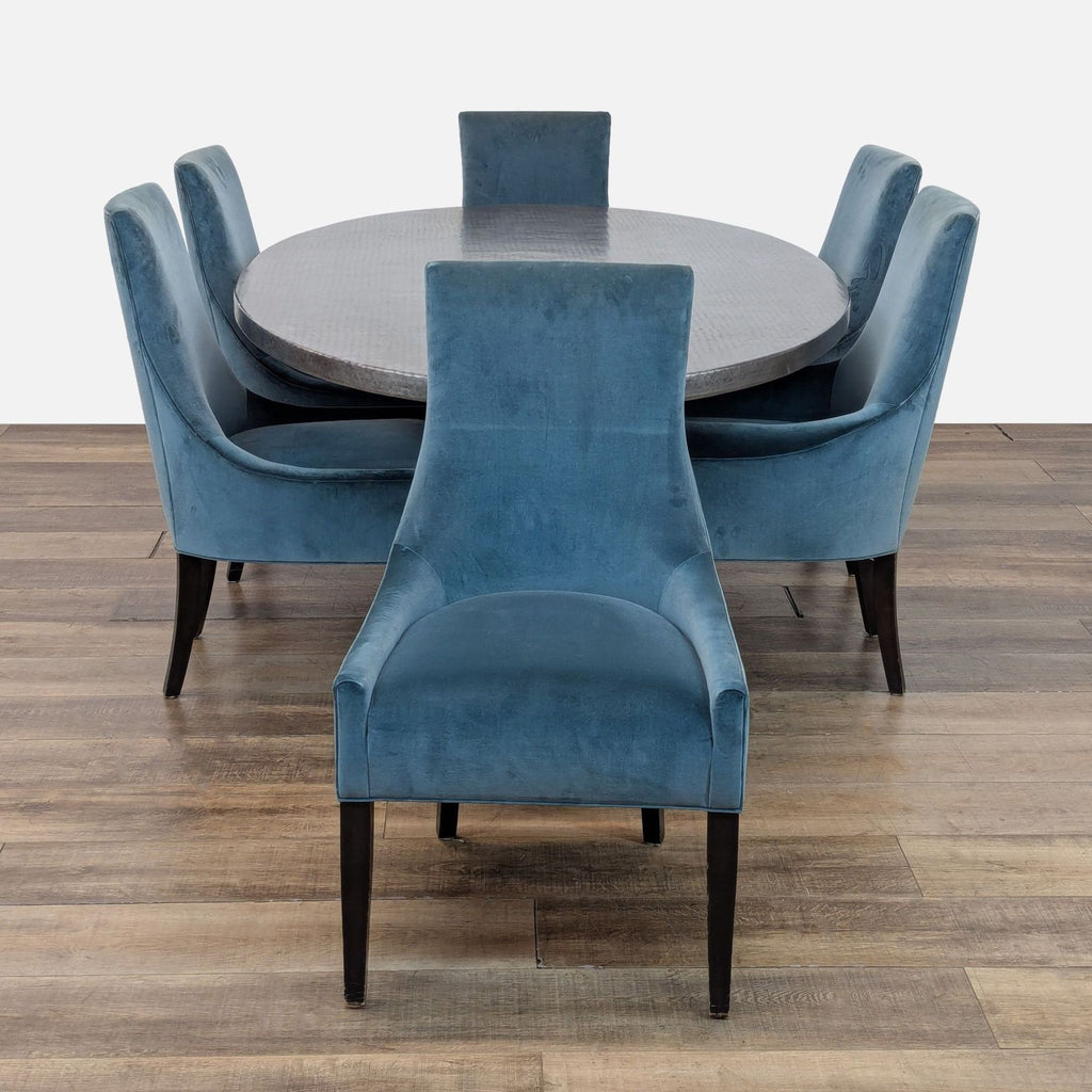 1. Kravet Furniture dining set with oval metal table and six blue upholstered chairs, shown on wood floor.