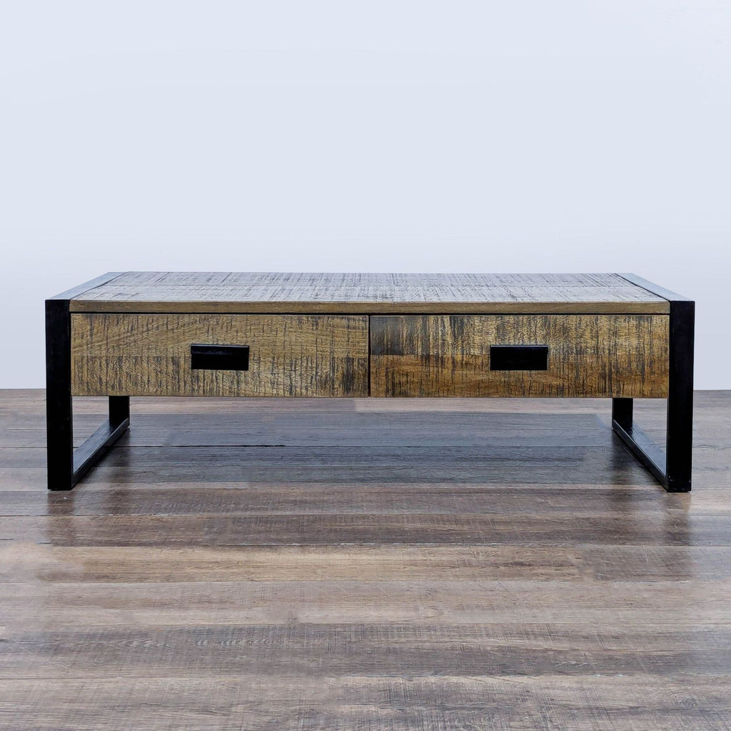 1. Reperch coffee table with reclaimed wood top, metal sled legs, and industrial hardware in an industrial style.  