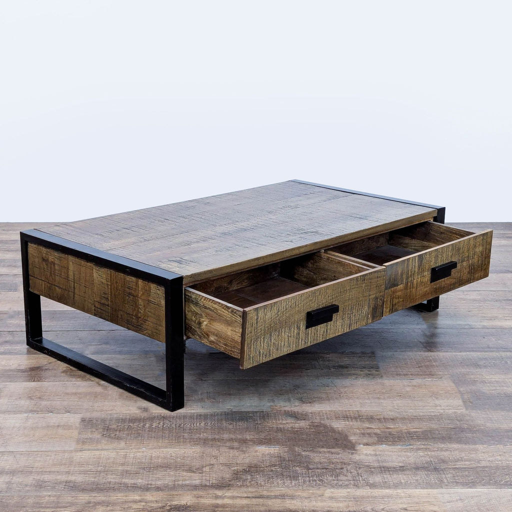 2. Industrial Reperch coffee table featuring metal sled legs and two open drawers made from reclaimed wood.  