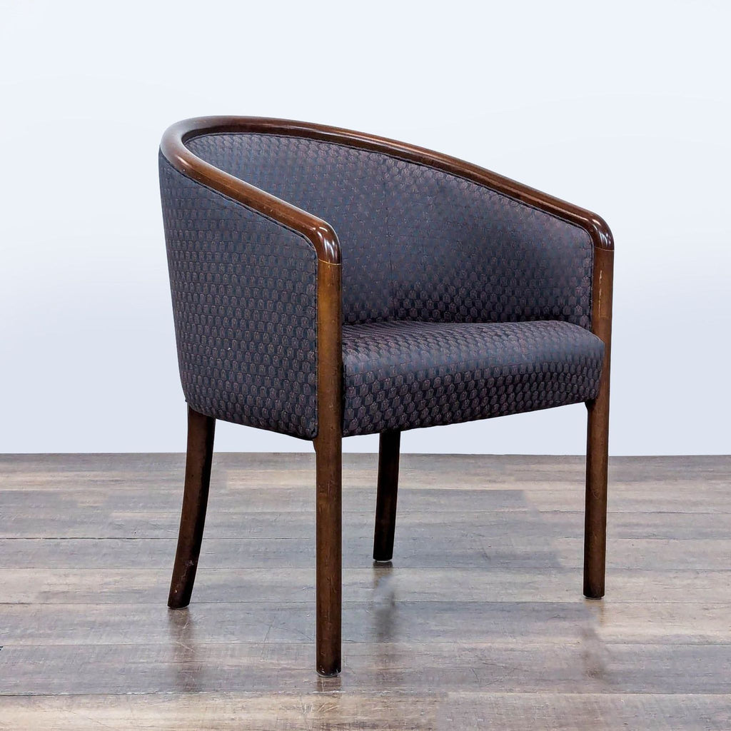 3. Angled view of upholstered barrel chair, dark wood legs, curved back/arms; lounge seating by Kimball.