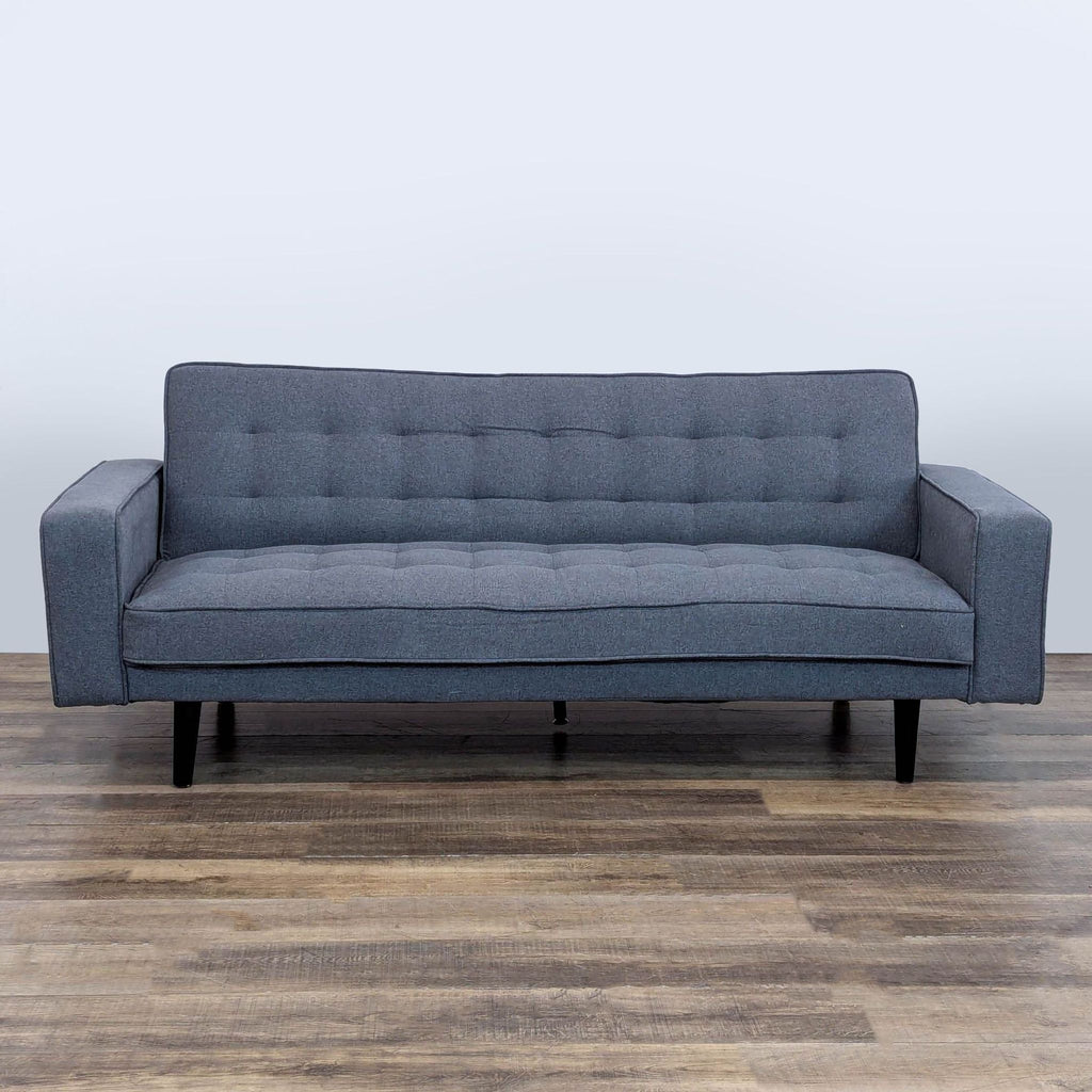 1. Reperch sleeper sofa with tufted cushions, track arms, and dark wood legs, seen from the front.