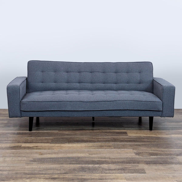 1. Reperch sleeper sofa with tufted cushions, track arms, and dark wood legs, seen from the front.