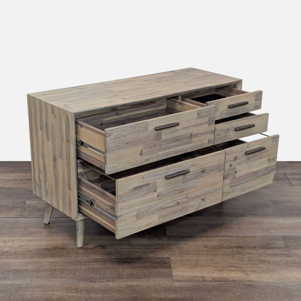 2. Side view of Design Evolution Furniture wood dresser, drawers open, displaying metal glides and handles.