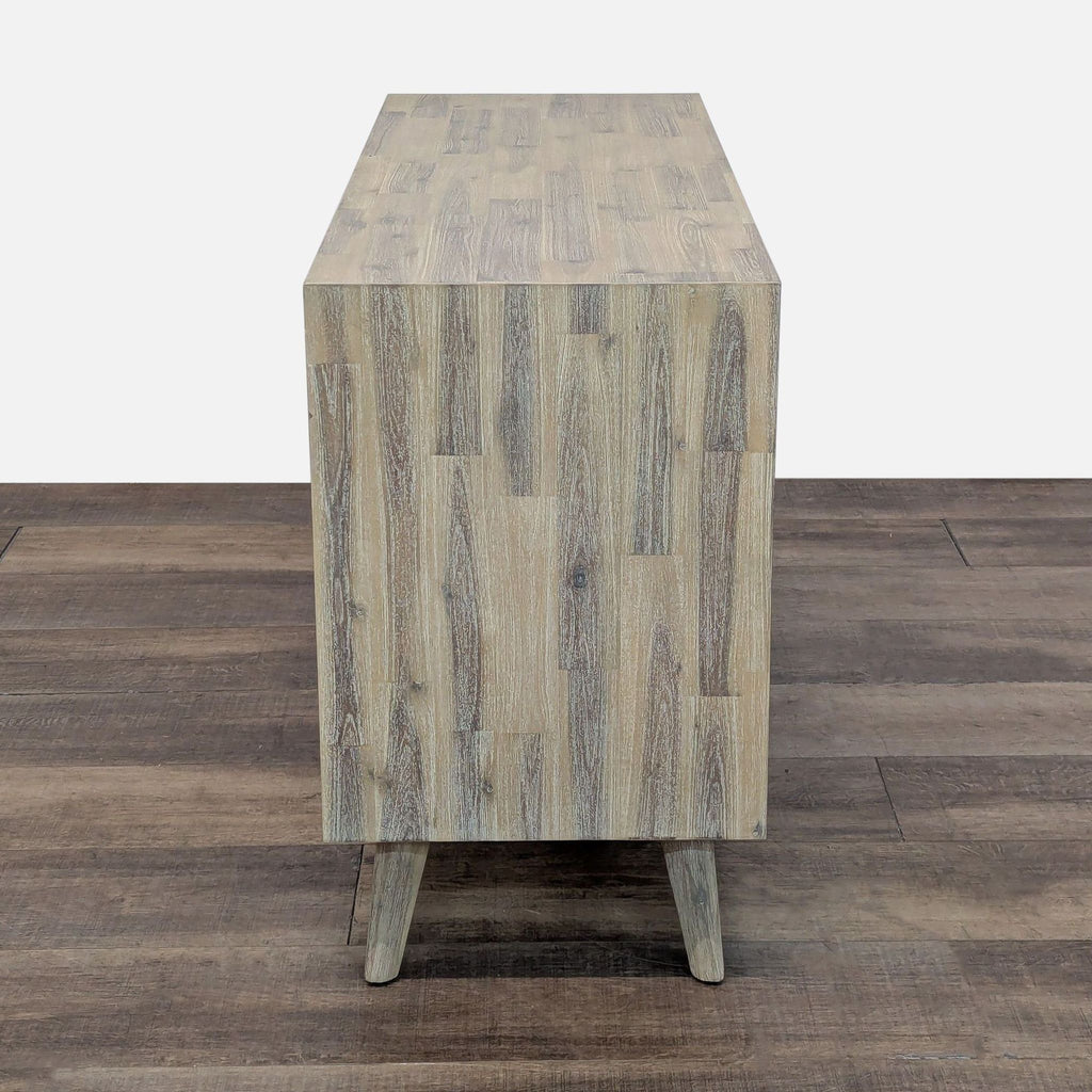 3. Modern wood dresser from Design Evolution Furniture, shown from the side with a clean, wood grain finish.
