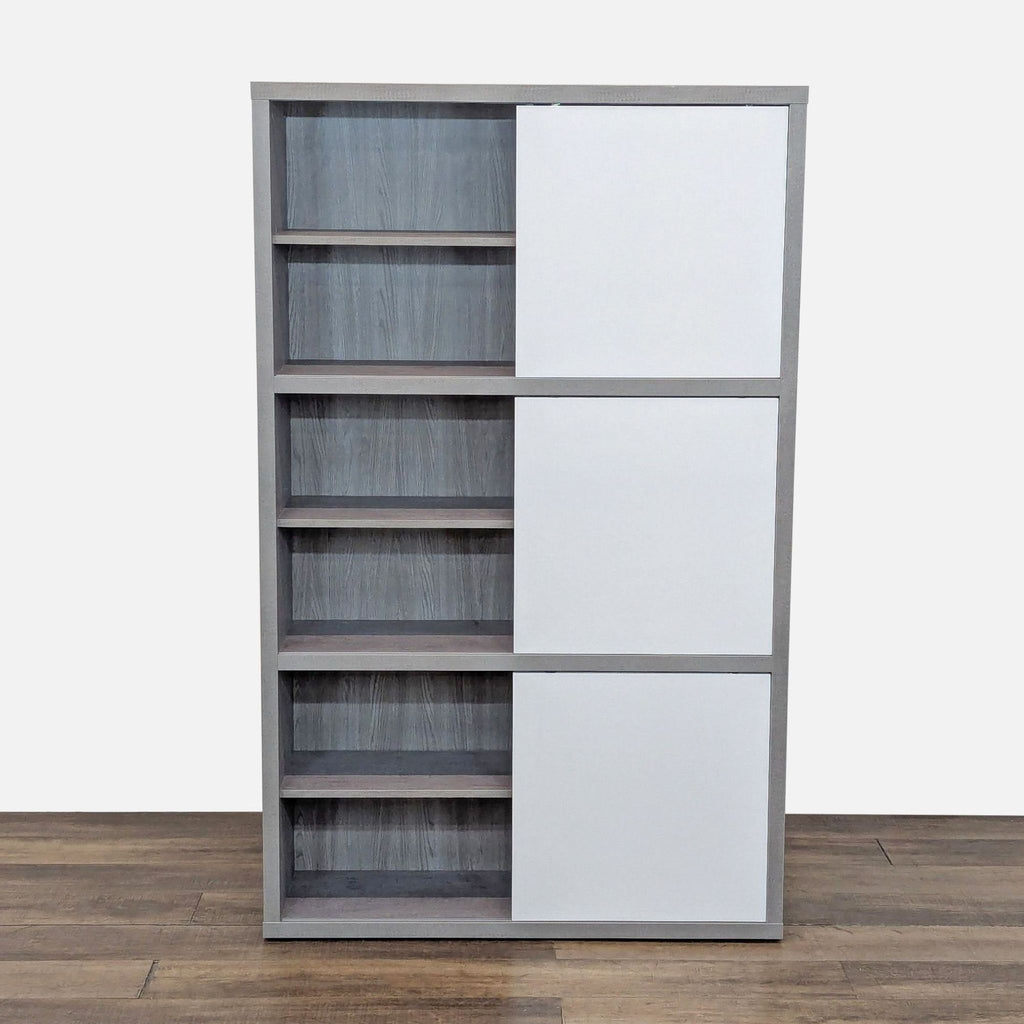 Modern bookcase with faux-cement finish and three high-gloss white sliding doors by Scandinavian Designs.