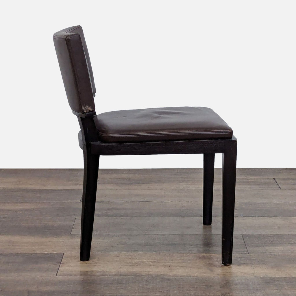 2. Side view of a Holly Hunt/Christian Liaigre Harry dining chair, showing wood frame and brown leather upholstery.