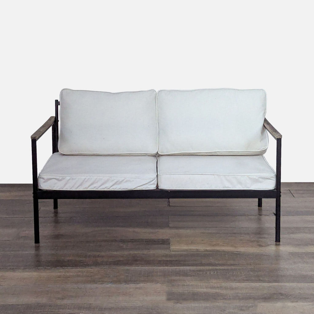 1. Reperch chair with metal frame, wood armrests, and white removable cushions, viewed from the front.  