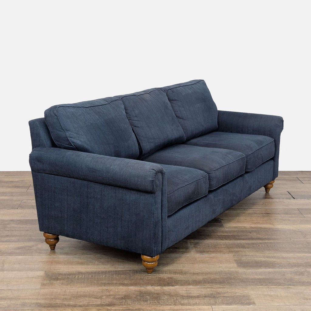 3. Angled view of La-Z-Boy 3-seat sofa in blue fabric, showing rolled arms and classic turned wood feet.