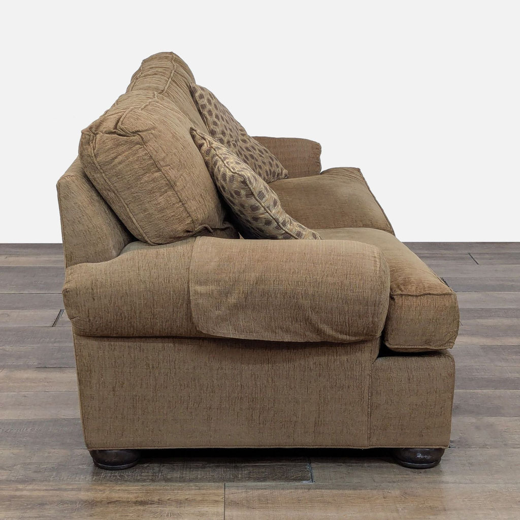 2. Side view of Ethan Allen brown 3-seat sofa with soft armrest and textured fabric, includes patterned pillows.