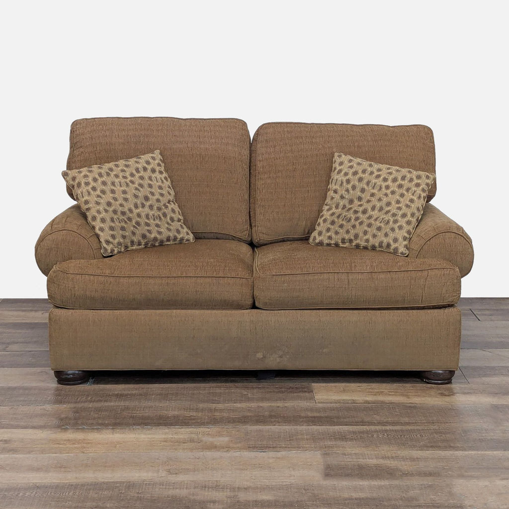 1. Front view of Ethan Allen loveseat with plush cushions, removable arm covers, wood feet, and two patterned pillows.