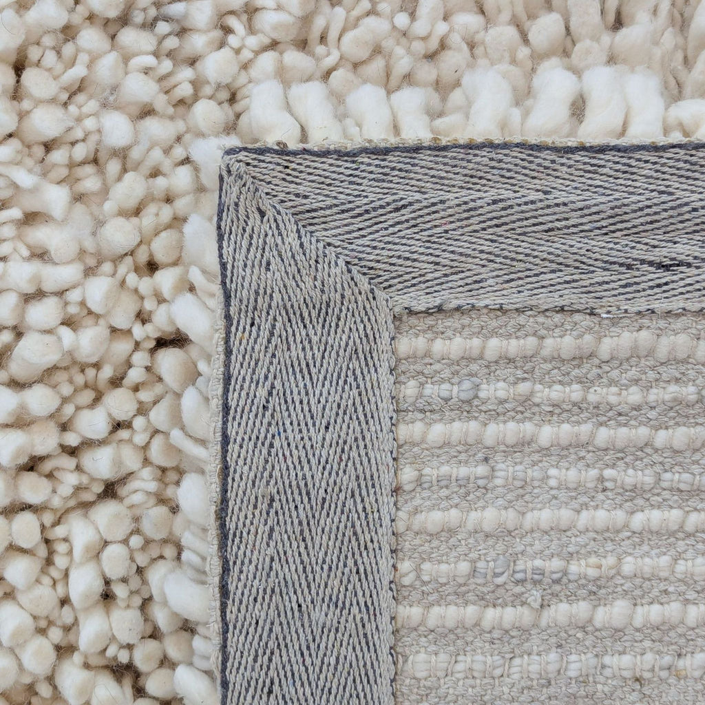 3. Detailed view of the rug's woven backing and plush wool-cotton pile from West Elm.